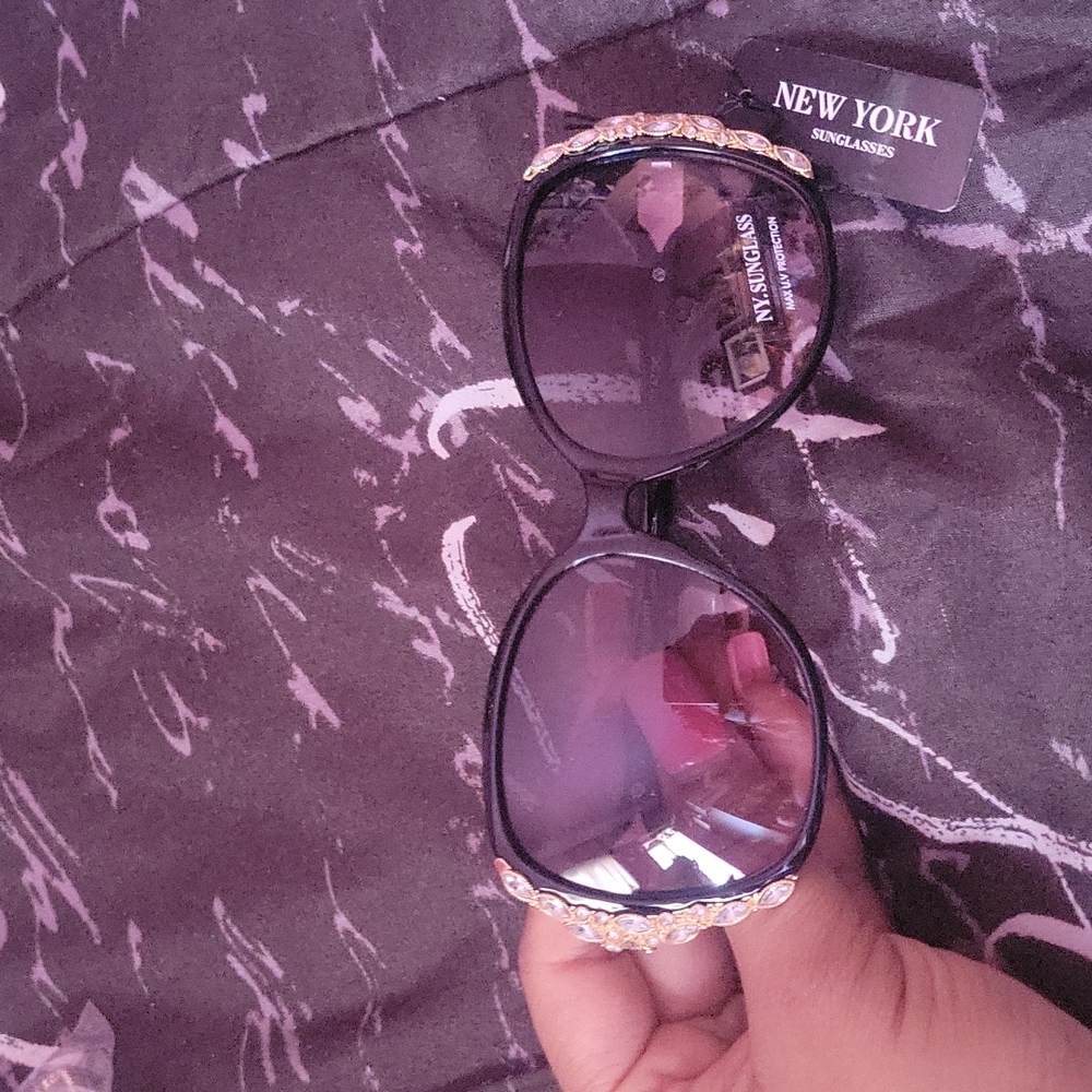 Black sunglasses with bling on them